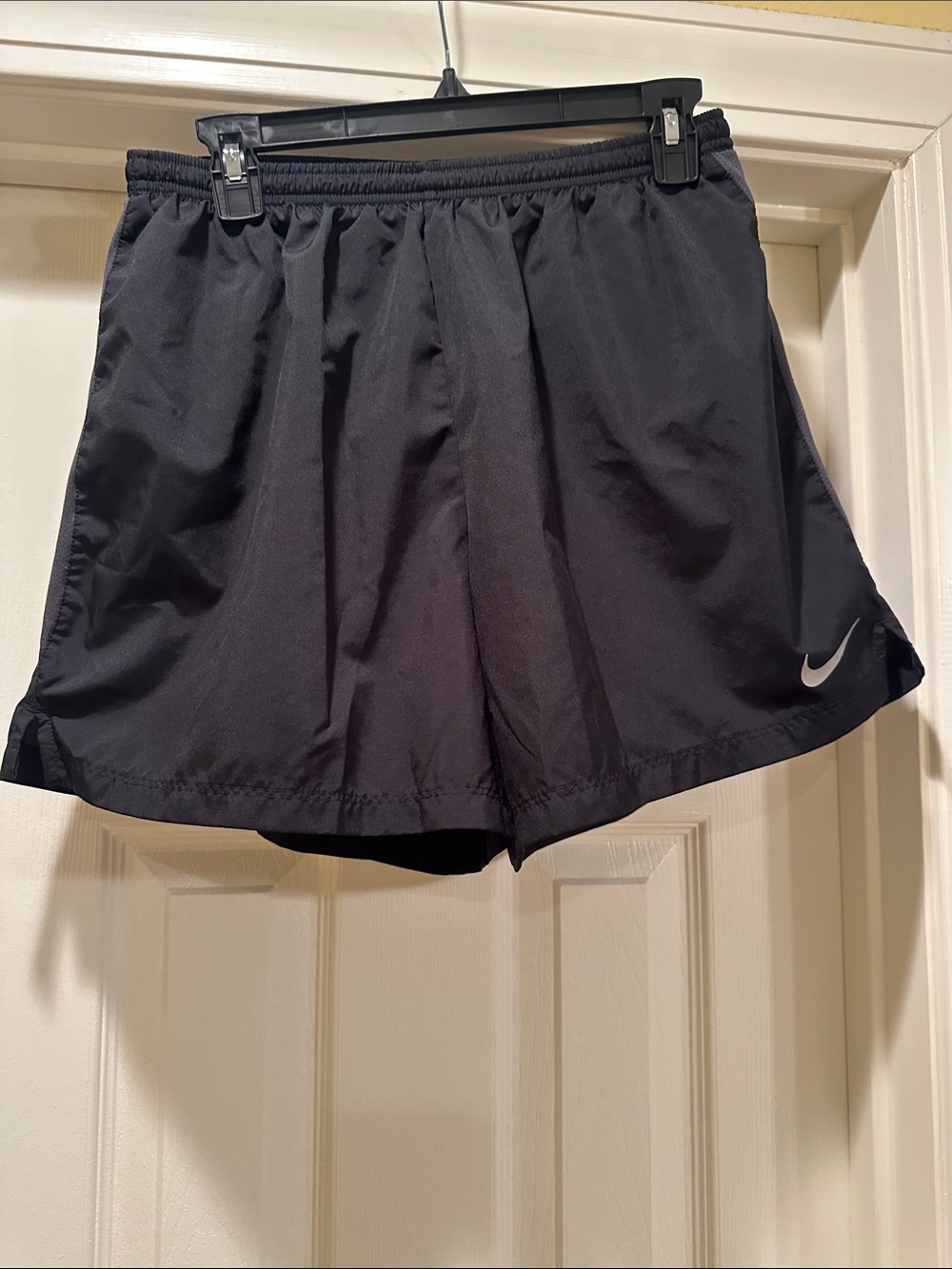 Nike Women's Black Athletic Shorts with White Swoosh Accent